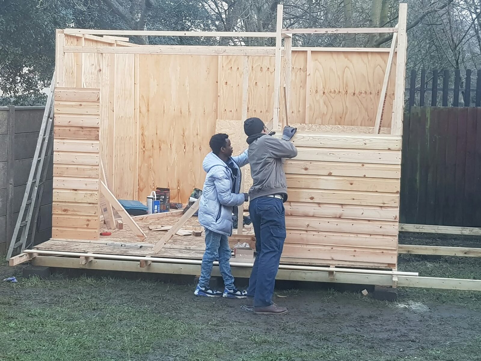 Foundations staff and a young person working together on a project